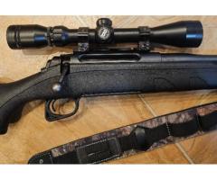 Remington 7mm rifle with scope