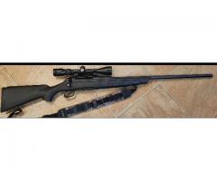 Remington 7mm rifle with scope